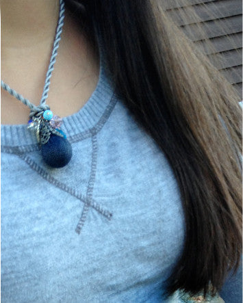 denim pendant with crystal & pewter dangles on dove grey twist cord—feature