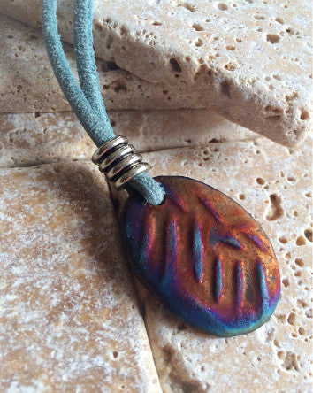 blue suede cord with oval design raku pottery pendant