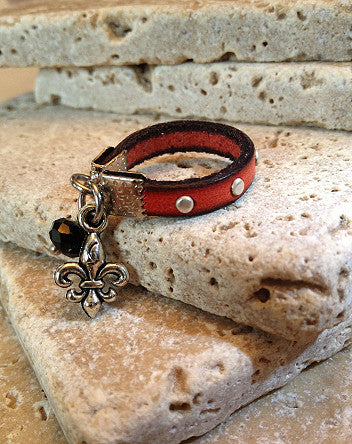 narrow studded leather with fleur de lys ring