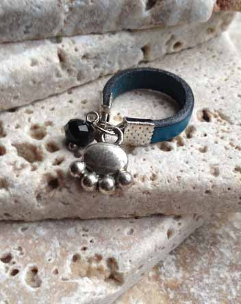 narrow leather and paw print ring