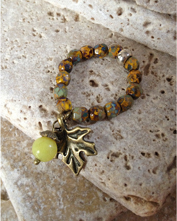 quaryd ring with tru.gigs—sunflower speckled olive picasso with bronzed leaf