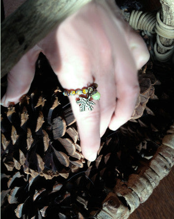 quaryd ring with tru.gigs—sunflower speckled olive picasso with bronzed leaf-feature