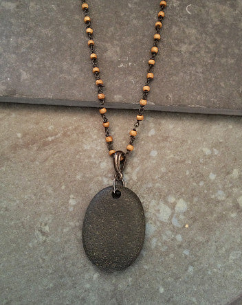 black quarried stone on bone-linked chain—feature | neckwear