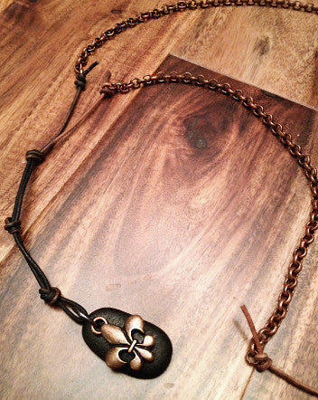 oxidized copper fleur de lis with black stone on copper rolo chain & leather cord