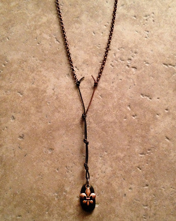 oxidized copper fleur de lis with black stone on copper rolo chain & leather cord