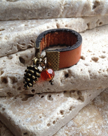 wide leather and pinecone ring