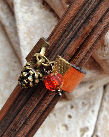 wide leather and pinecone ring—feature