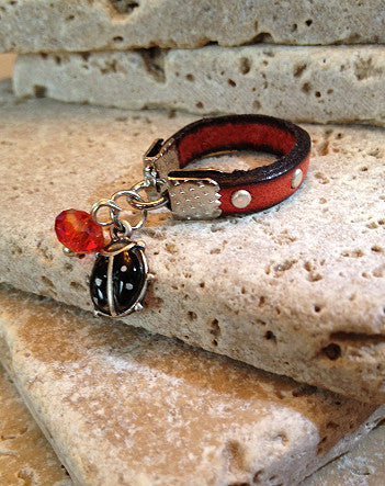 narrow studded leather with lucky ladybug ring