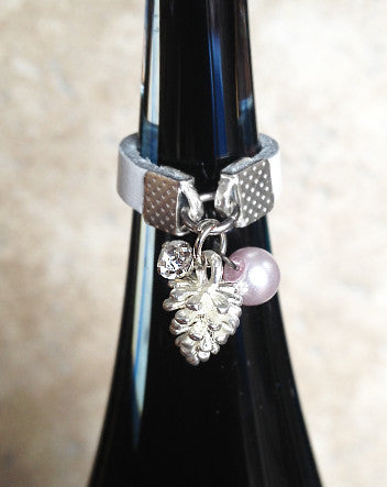 narrow leather and silver-plated pinecone ring