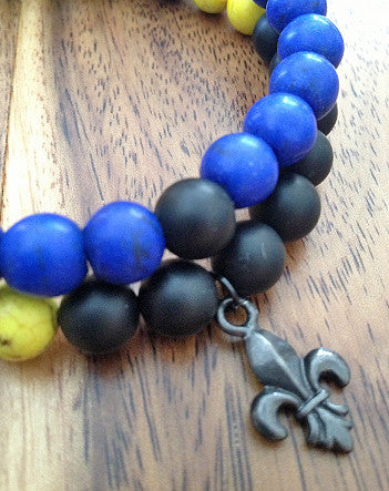 quaryd 8mm wristwear—with tru.gigs: matte black onyx & yellow magnesite with fleur de lys