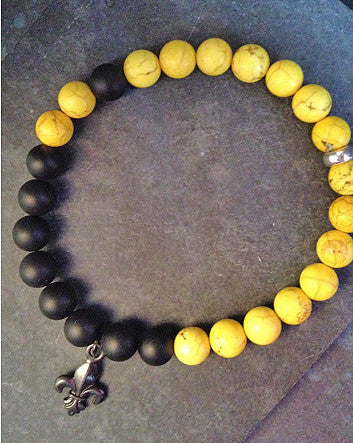 quaryd 8mm wristwear—with tru.gigs: matte black onyx & yellow magnesite with fleur de lys