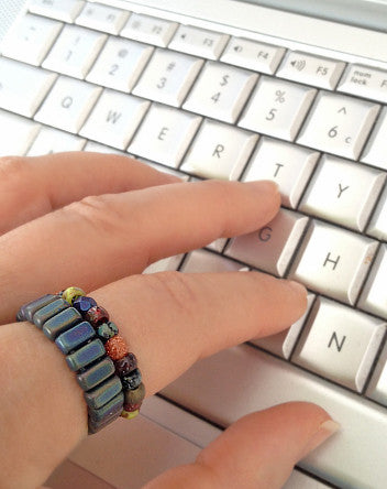 quaryd ring—dark pigment stone mix with copper and goldstone