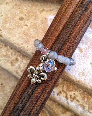 quaryd ring with tru.gigs—moonstone in grey & crystals with fleur de lys