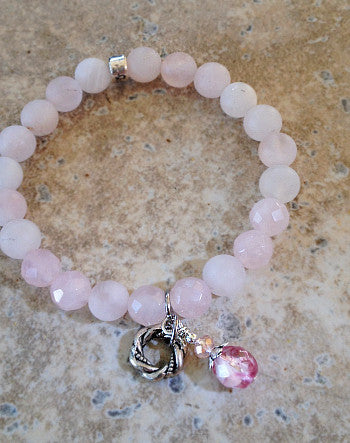 8mm quaryd bracelet with tru.gigs: rose quartz, eternity knot & swirled crystal drop